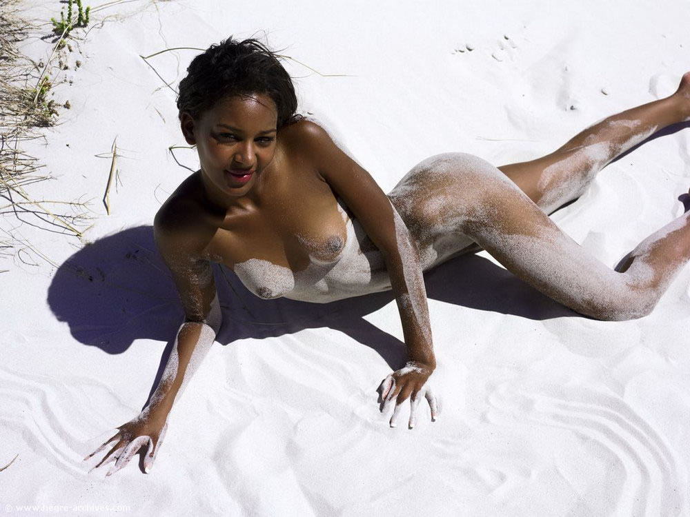 Skinny black Hegre Art model Naomi poses naked on beach in White Sands.